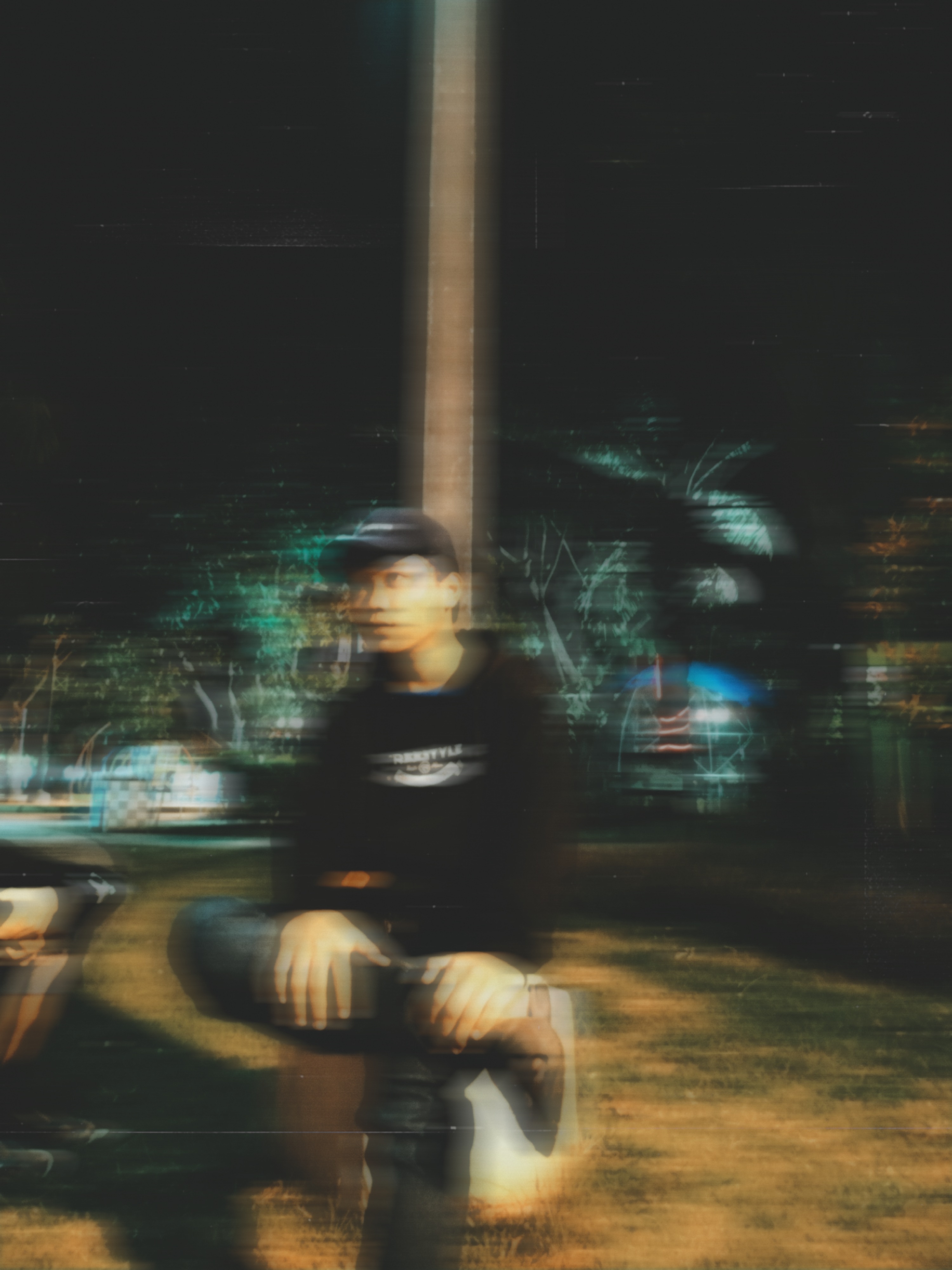 Alfin Reswara in an atmospheric night portrait